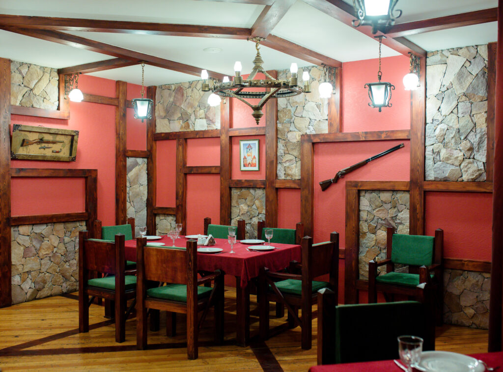 restaurant room with guns on wall
